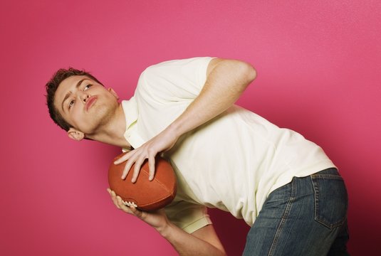 Teen Holding Football