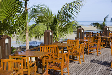 Table and chairs in empty cafe  at island Koh Chang , Thailand.
