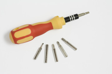 Screwdriver whith a bits on a white