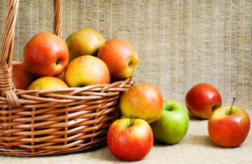 Fresh colourful apples in a basket, soft focus