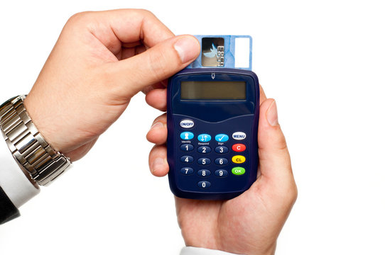 business man holding a card reader with a credit card inside