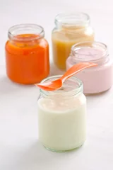 Foto op Plexiglas baby food: rice pudding, apple and carrot puree and yogurt © victoria p.