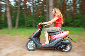 Fototapeta na wymiar woman driving a scooter