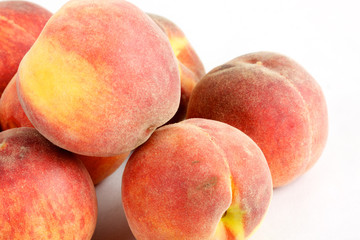 Fresh peaches - isolated on white