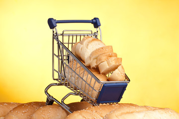 metal shopping trolley filled with bread