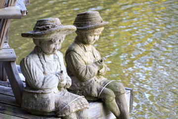 Statues by the water