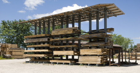 stack of wood under cover