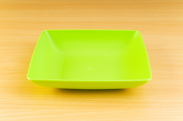 Empty plate on the wooden table