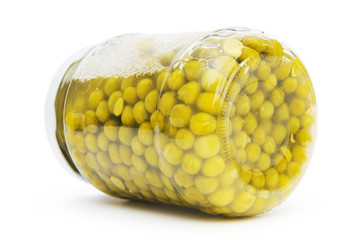 Green peas in glass jar isolated on white