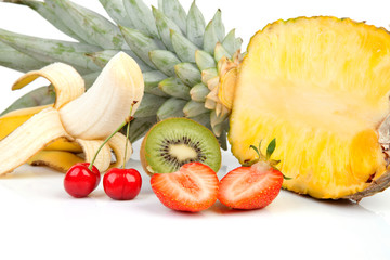 tropical fruits over white background