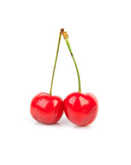 fresh red cherries over white background