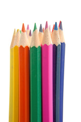 colorful pencils over white background
