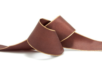 knot in brown ribbon with gold edge over white background