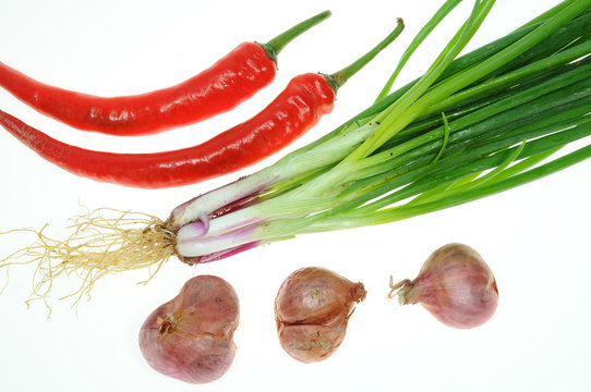 Some Chili, Spring Onion And Onions On White background