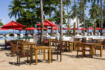 Table and chairs in empty cafe at island Koh Chang , Thailand.