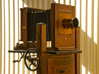 Antique mahogany wood view camera on rolling stand