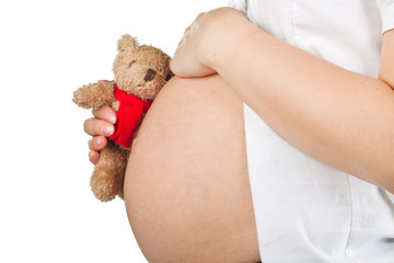 pregnant belly over white