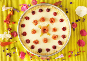 cheese cake on apple green background wit flowers