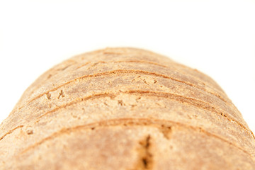 long loaf of hot whole rye kosher bread isolated on white