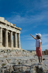Child points to  Ancient Parthenon Facade in Acropolis Athens Gr