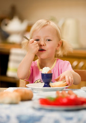 girl eating breakfast
