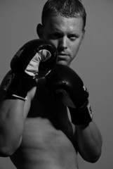 handsome male wearing boxing gloves