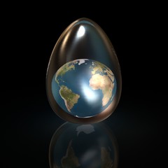 Glass egg. Inside the egg is a globe. Black background