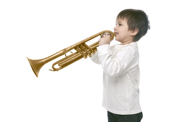 Boy playing on a trumpet