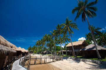 Row of traditional chalet at tropical resort