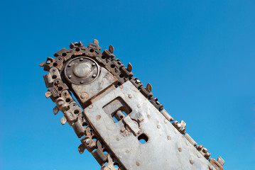 Trench digger over blue sky