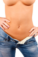 Naklejka premium Torso of a girl in blue jeans