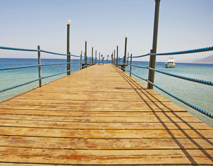 Wooden jetty on a tropical beach