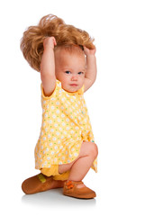 Baby trying on a wig