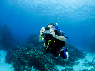 scuba diver with small camera