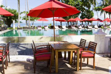 Table and chairs in empty cafe at island Koh Chang , Thailand.