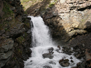 waterfall in narrow canyon of Altai mountains
