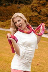 young beautiful autumn woman in the park outdoors
