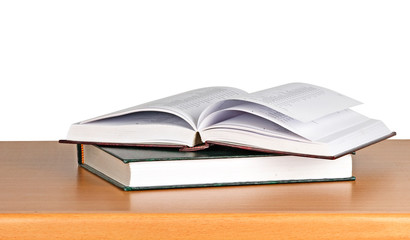 Open book on desk on white background