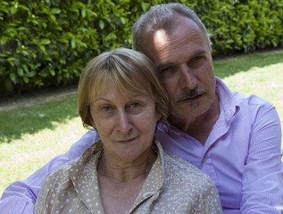 Obraz premium Senior Couple relaxing in the Garden