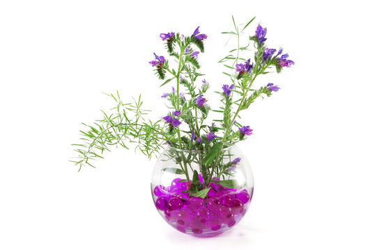 Wild flowers in a vase with colorful crystal flowers