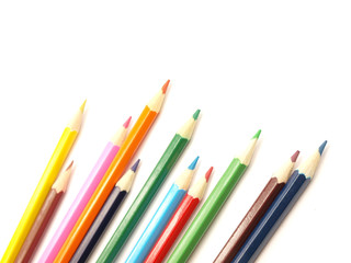 Colored pencils on white background