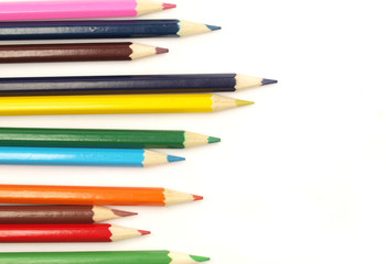 Colored pencils on white background