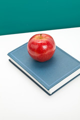 Red apple and Textbook