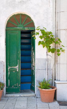 Wooden green door.