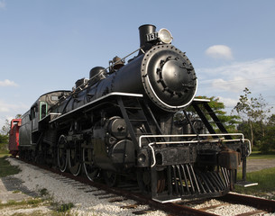 Old steam locomotive engine in a sunny Florida day