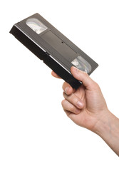 Hand with video cassette isolated over white