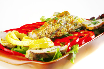 roast atlantic tuna with vegetables on plate