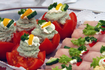 Relishes plate with tomatoes, ham and vegetable
