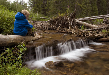 Boy by creek