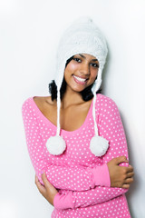 young smiling girl with snow hat warm pink winter blouse